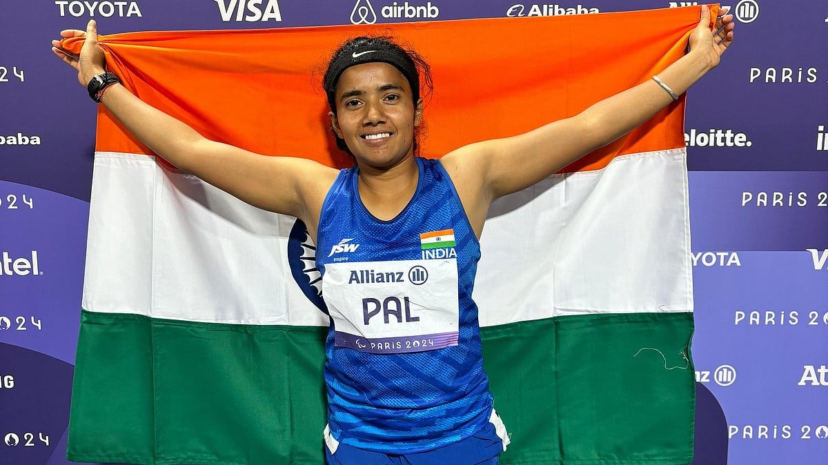 PCI : India's Preethi Pal poses with the flag after clinching bronze in the 100m event.